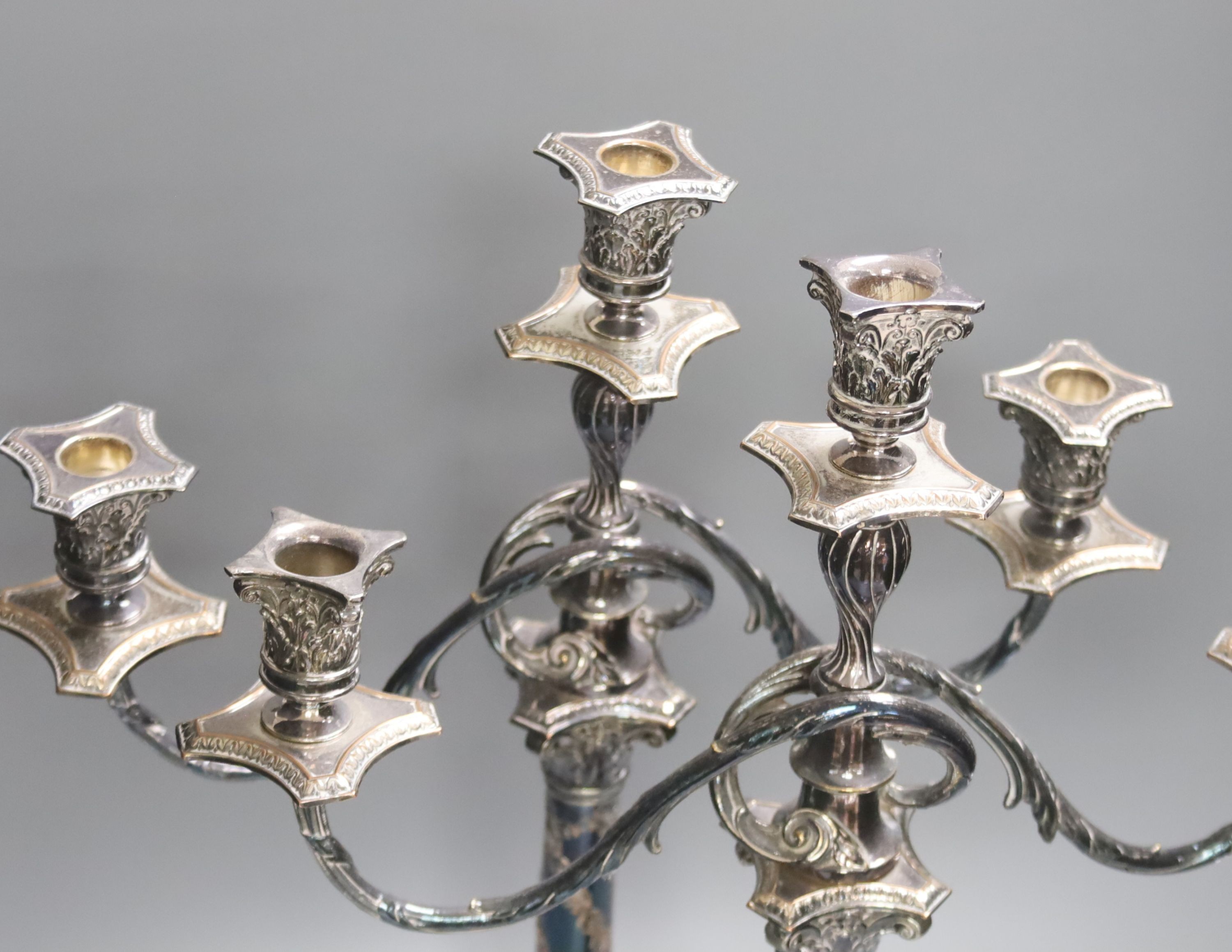 A pair of Georgian style plated two-branch three-light candelabra, height 53cm